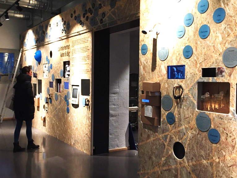A view of the exhibition, made out of screens, plywood, and interactives