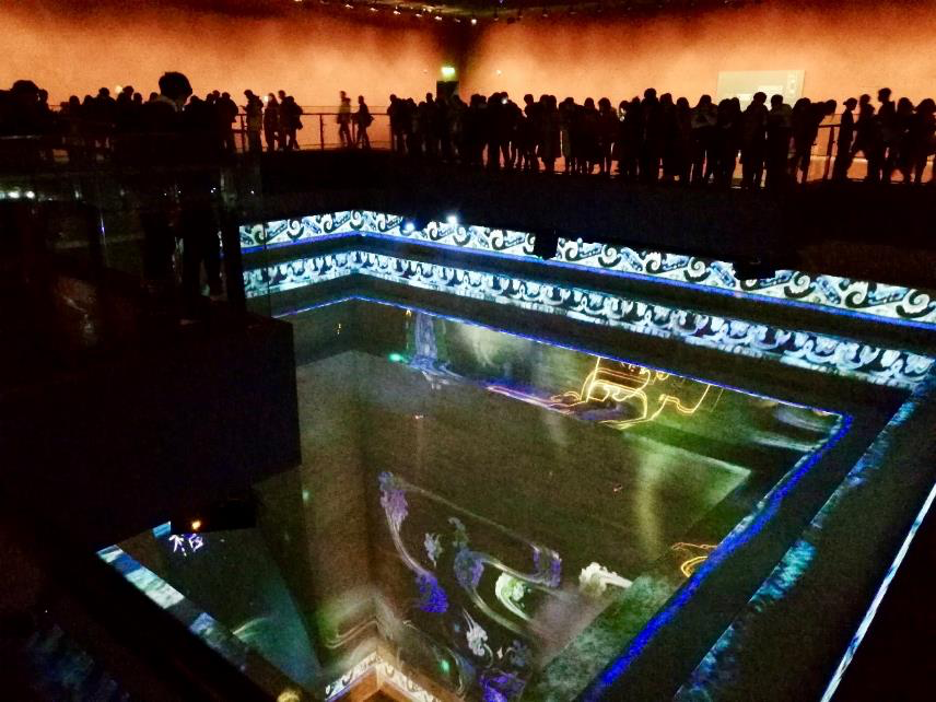 A photo showing what the "Dream of Eternity" exhibition looks like with viewers inside it.