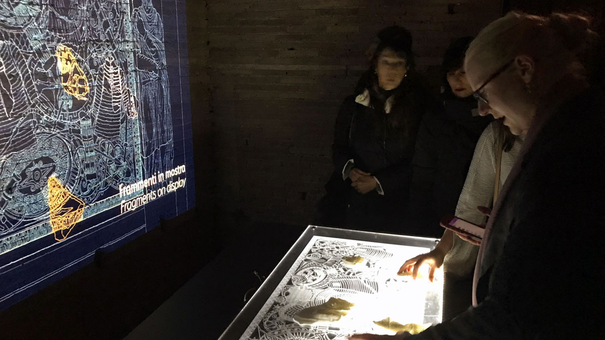 A photo of people looking at the completed table. 
